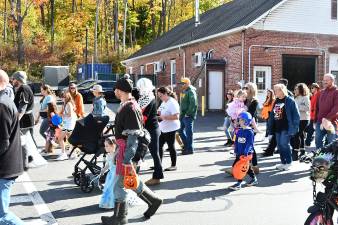 Participants march in the Ogdensburg Halloween Parade on Sunday.