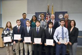 Rep. Josh Gottheimer and others pose with students nominated to the U.S. Naval Academy.