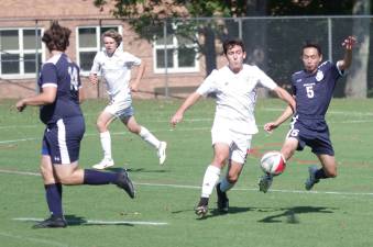 Pope John's Jakob Makeover kicks the ball late in the game.