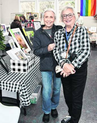 Cathy Goodwan and Heidi Greg, both of Sparta are shown by a table.