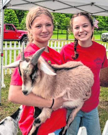 <b>Makenna O'Rourke and Kaylin Byro are shown iwth Savash.</b>