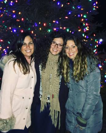 From left to right: Nikki Brand, Ali Ball and Meredith Reilly remember their mother at last year's "Light Your Life with Love" celebration. (Photo provided).