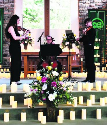 From left, Lucy Voin, Tom Valdez and Nick Pauly perform.