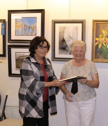 Sussex County Freeholder Sylvia Petillo presenting an award to artist Jill Dickerson