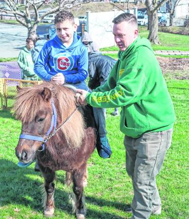 Jimmy Wade, 9, rides a pony.