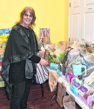 Denise DeSaliva of Vernon places a ticket into a bag.