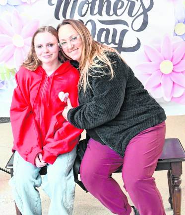 Michelle and Kylie Sarno pose for a photo.