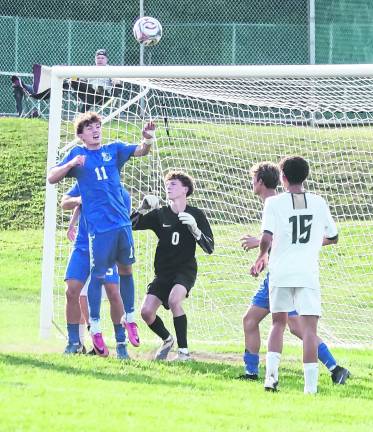 The Sussex Tech Mustangs and the Kittatinny Cougars in action in front of the goal post.