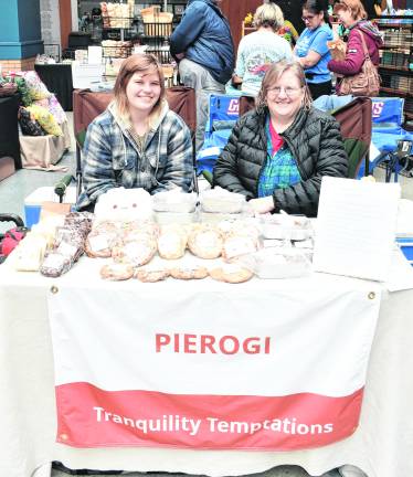 Emily and Heidi Bilik of Fredon sit at the Tranquility Tempations table.