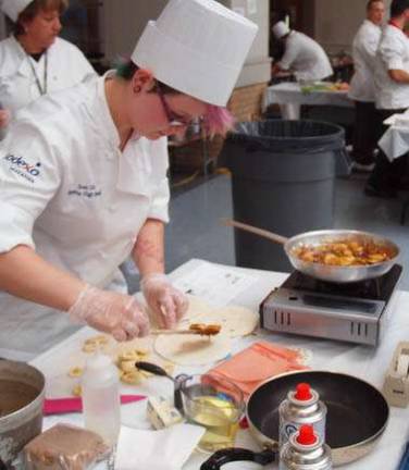 Carolyn Simmons of team two caramelize some bananas.