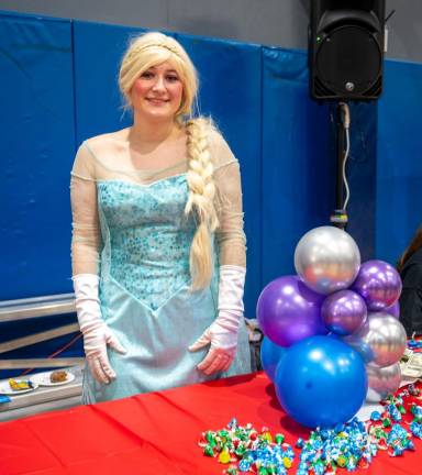 Julia Volker of Unique Parties by Katie was dressed as Elsa, a character in the movie ‘Frozen.’
