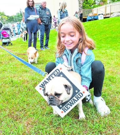 Vivienne McMichael poses with her dog, Hugo.