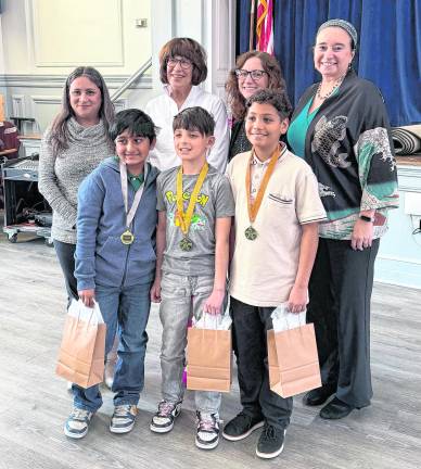 From left, back, Lenore Davis, Maureen Dugan, Kelly Kiff, Andrea Diamond; front, Rohan Sharma, Lucas Jaffe, and Matthew Herasme.