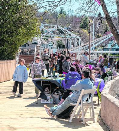 The crowd walks along the boardwalk at Springfest in Lake Mohawk.