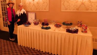 JoAnne Scheidt (L) and Melodie Novak show off the candy buffet they designed for the Sussex County Arts &amp; Heritage Council's Masquerade Gala, held Friday, Oct 11, 2019 at the Lafayette House in Lafayette.