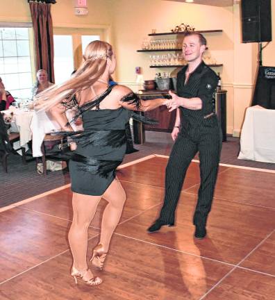 Award-winning dance instructors Olena Shvets Nikishkin and Dmitry Nikishkin dance.