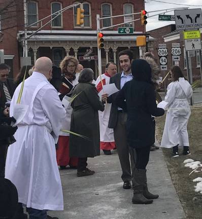 The congregation heads back to the church for Mass