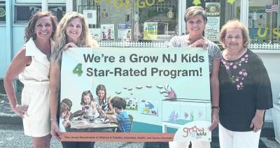 Staff members at Garden Grove Preschool pose for a photo.