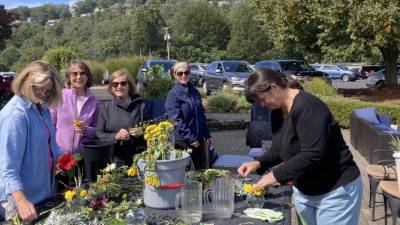 Garden Club members make arrangements with flowers from their home gardens. (Photos provided)