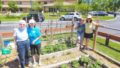 Volunteers Mary Spector, Marie Wilson, Claudia Kunath and Anita Schweizer are among the many expert gardeners who design and maintain the community gardens at Project Self-Sufficiency. (Photo provided)