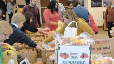 Volunteers pack Thanksgiving dinners at Project Self-Sufficiency (Photo provided)