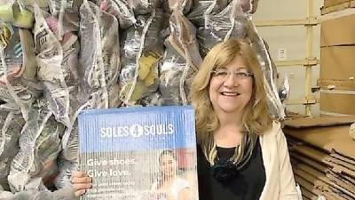 Karen Rothstadt, International Relations Committee chairperson for the Vernon Township Woman's Club, holds Soles4Souls boxes for the club's shoe drive that will be launched after the stay-at-home order is lifted.