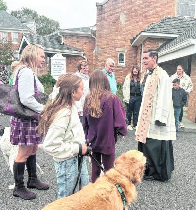 A large crowd gathered at Our Lady of the Lake Church on Oct. 4 for its annual Blessing of the Animals honoring the Feast of St. Francis of Assisi.