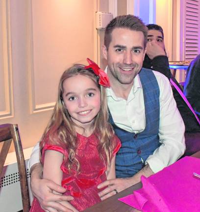 Vivienne McMichael is with her father, Jim.