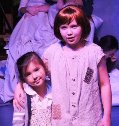 Annie, played by Danielle Perry, comforting Molly, played by Jennifer Kollar