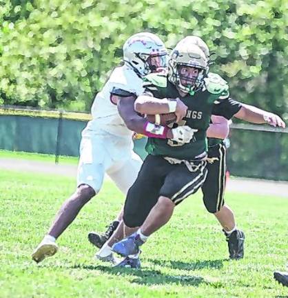 Sussex Tech running back Dane O'Malley carries the ball.