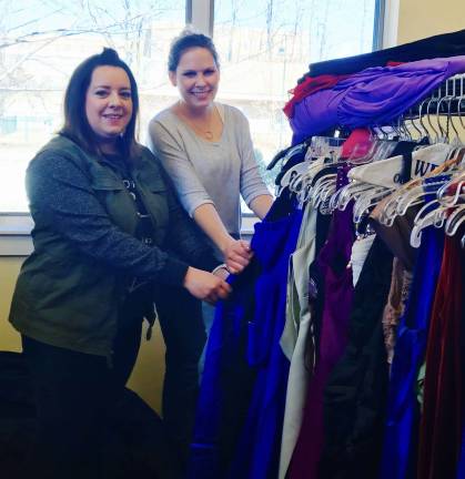 Kristen Szolusha and Ashley Zuidema from Selective Insurance volunteered their time to help put together the Prom Shop Photos by Laurie Gordon