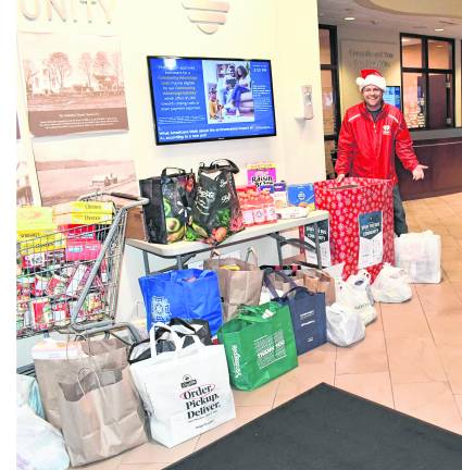 Steve Allan of WSUS radio is shown with donations.