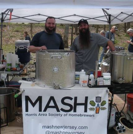 MASH-NJ Treasurer Micha Stark (left) and President Karl Weiss celebrate National Homebrew Day, Saturday, May 5, 2018 at the Great Divide Campground in Andover. Photos by Mandy Coriston