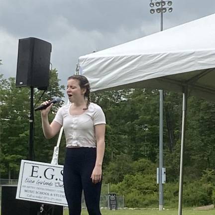 Megan Armstrong, 17, of Sparta sings during Sparta Day. She is a student at Elisa Girlando Studio.