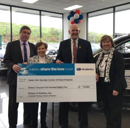 From left to right: John Quinlan, Julia Quinlan, Chris Dexter, and Marlina Schetting as Dexter presents the check to Co-Founder and CEO, Julia Quinlan. (Photos by Laurie Gordon)