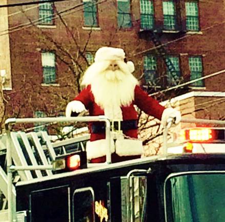 Old St. Nick arriving at last year's Newton parade Photo by Laurie Gordon