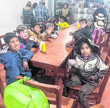 James Kierans is shown with children at a Peruvian orphanage.