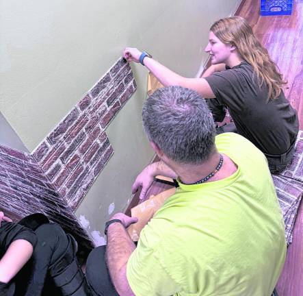Abigail Weisbeck renovates the Sparta Food Pantry.