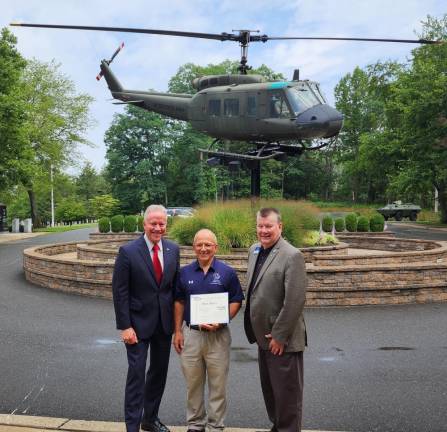 Col. Joseph Abegg, left, New Jersey state president of the Air &amp; Space Forces Association, and Jim Simon, vice chairman of the board, field operations, pose with Sparta High School teacher Mark Meola, center.