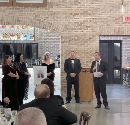 From left, Lisa Tremonte, Laura Tremonte, Julia Dick, Salvatore Dispenziere III and Brad Haimowitz present the Michael De Vito Jr. Scholarship at the ERC Charities’ gala Feb. 2 at Perona Farms. (Photos provided)