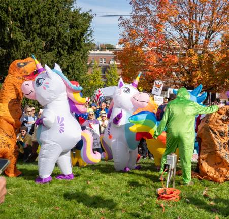 People in costumes dancing.