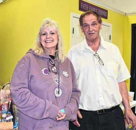 Lisa Hilton ad Rob Graham, both of Sandyston stand in front of the items being raffled.