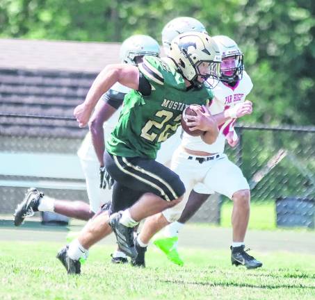 Sussex Tech ball carrier Bret Kellenberger gains yards in the open field.