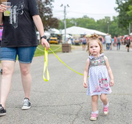Ottilia, 2, of Dingmans Ferry explores the NJ State Fair with mom Madeline (Photo by Sammi Finch)