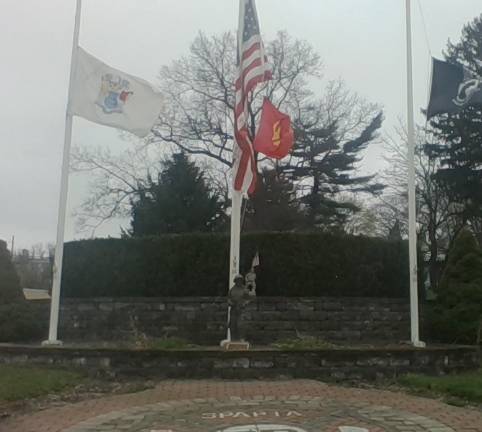 Flag poles and monument at the Sparta Volunteer Fire Department.
