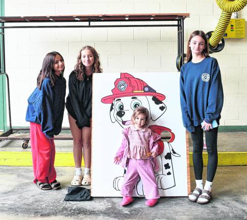 Daniela Duru, Ayla Steffen, Bade Duru and Madelyn Adamas, all of Sparta, pose for a photo.