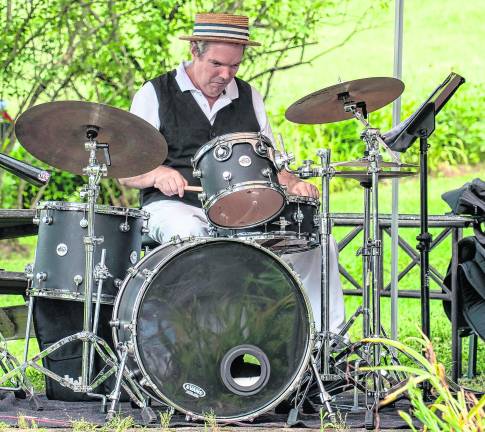 Wayne Duntam performs on drums.