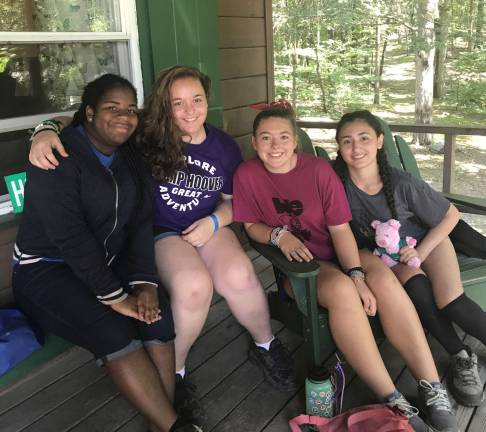 From left, Mia Singleton, Emma Zwizkel, Isabelle Holt, and Carolina Lopez are all Counselors in Training at Camp Lou Henry Hoover implementing the G.I.R.L. philosophy. Photo by Laurie Gordon
