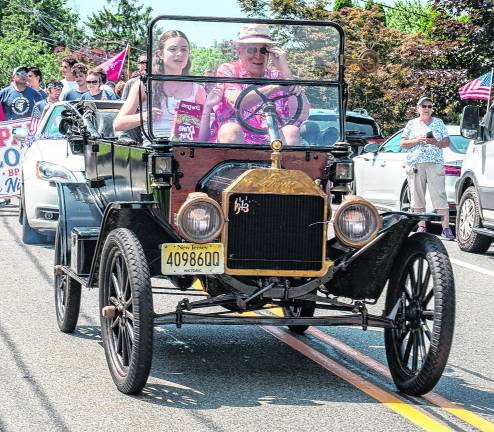 The Sparta Historical Society is represented in an antique car.
