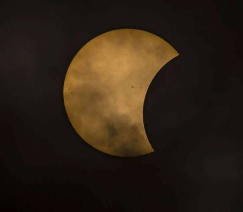 PHOTO COURTESY PAUL MICHAEL KANEThie photo shows the moon beginning to eclipse the sun during Monday's solar eclipse.